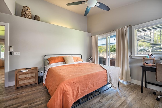 bedroom with ceiling fan, hardwood / wood-style floors, and access to outside