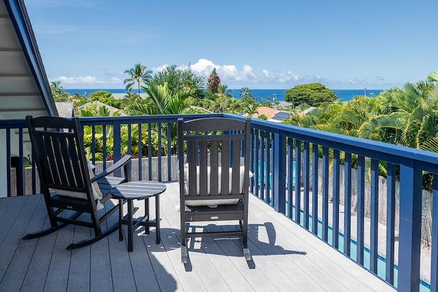 wooden deck with a water view