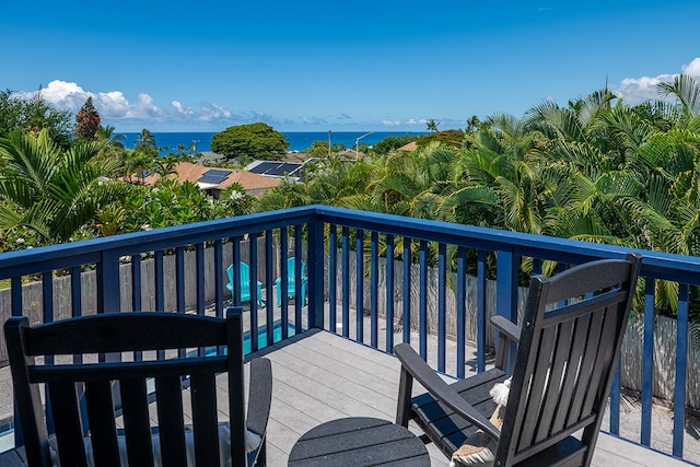 wooden terrace featuring a water view