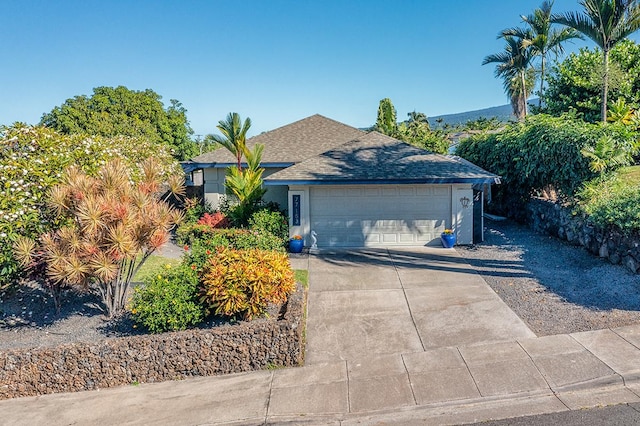 ranch-style home featuring a garage