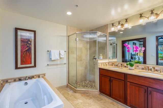 bathroom featuring vanity and shower with separate bathtub