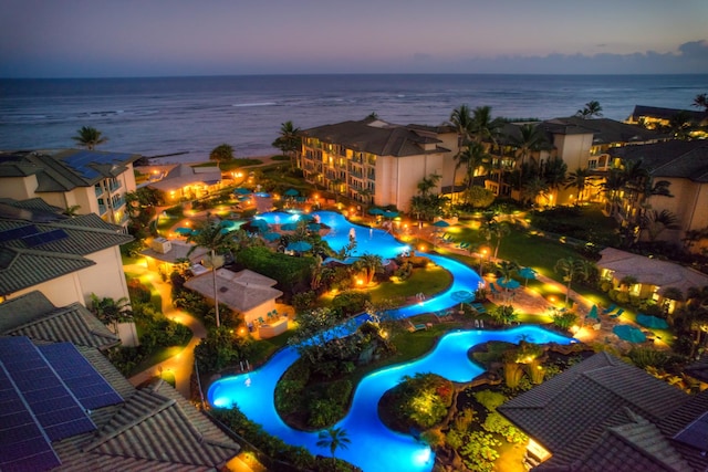 aerial view at dusk with a water view