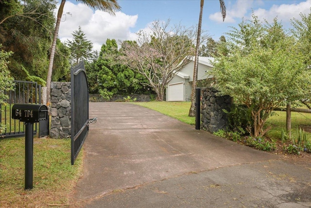 view of gate with a garage