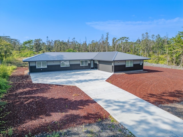 single story home featuring a garage