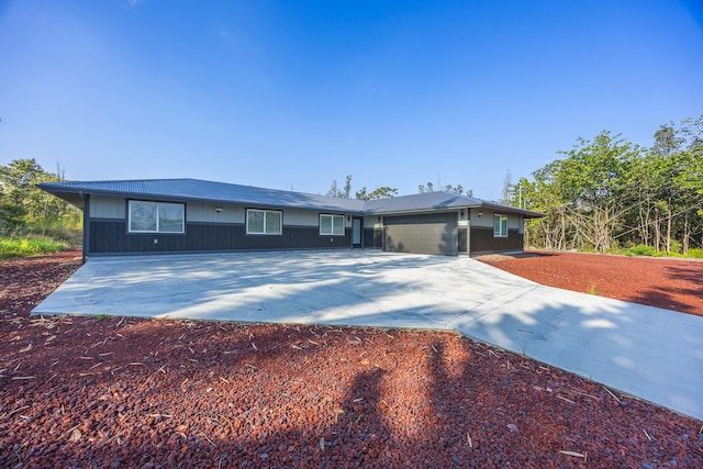 single story home featuring a garage