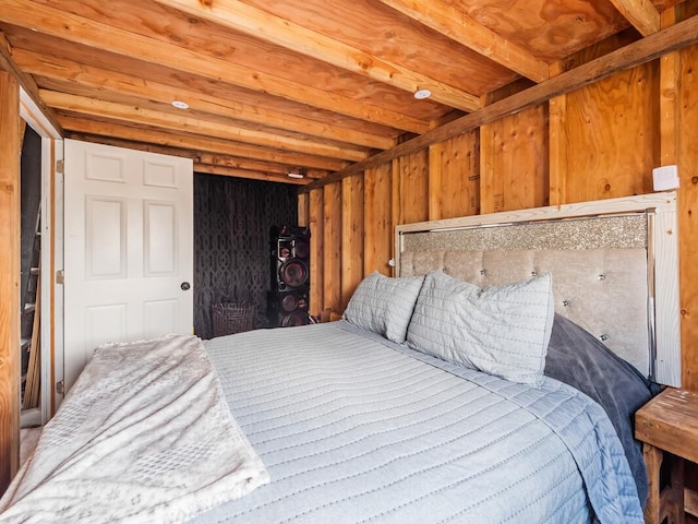 bedroom with wooden walls