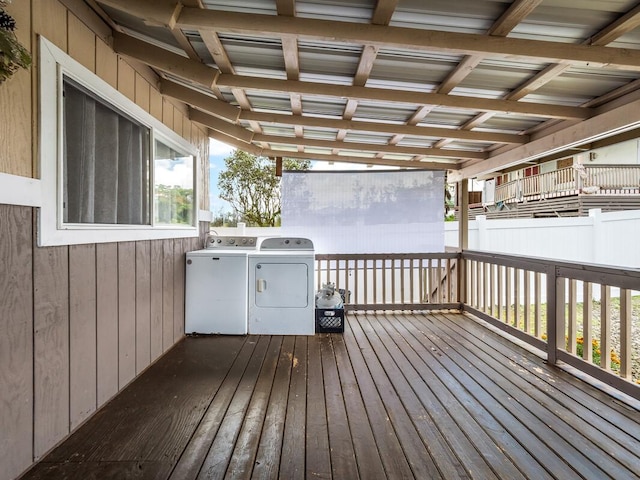 deck featuring washer and clothes dryer