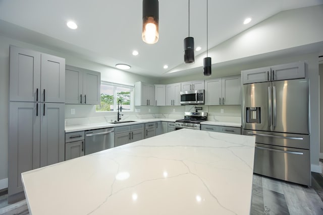 15-1836 11th Ave, Keaau, HI 96749 - kitchen featuring a sink, stainless steel appliances, pendant lighting, light stone counters, and lofted ceiling