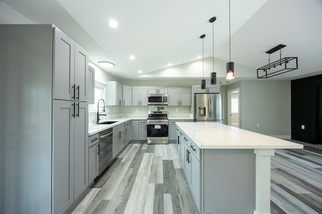15-1836 11th Ave, Keaau, HI 96749 - kitchen featuring a sink, stainless steel appliances, light wood-type flooring, gray cabinets, and vaulted ceiling