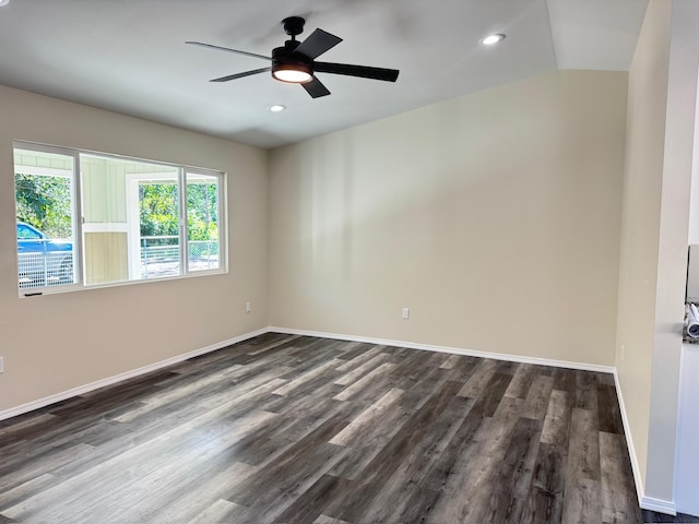 unfurnished room featuring ceiling fan, lofted ceiling, and dark wood-type flooring