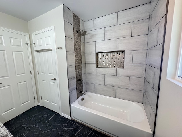 bathroom with tiled shower / bath combo