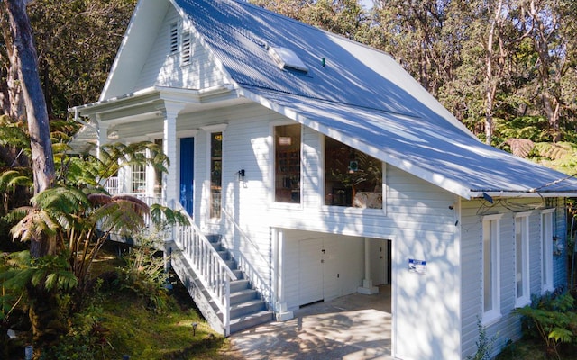 view of front of property with a garage and a porch