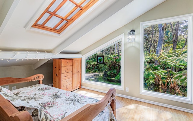 bedroom featuring vaulted ceiling and hardwood / wood-style floors