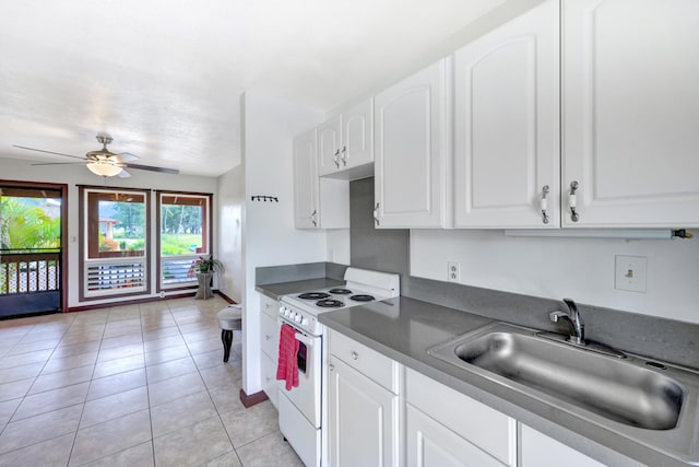 kitchen featuring white cabinets, white electric range, sink, and light tile patterned floors