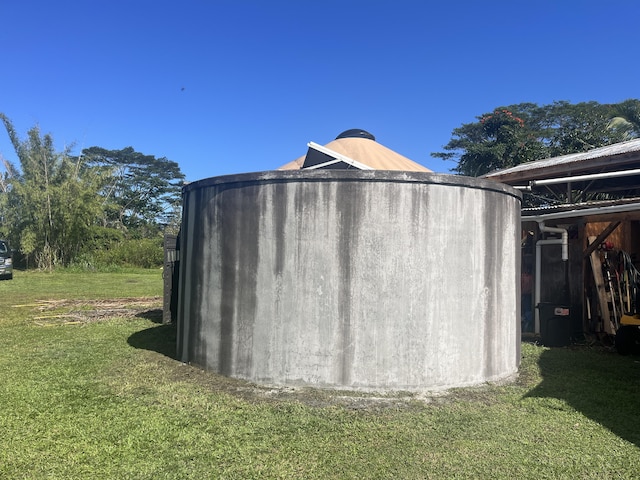 view of outbuilding with a yard