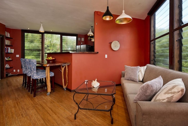 living room featuring plenty of natural light and hardwood / wood-style floors