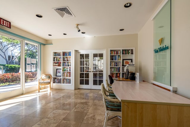 unfurnished office featuring french doors