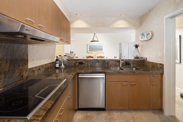 kitchen with pendant lighting, sink, dark stone counters, stainless steel dishwasher, and black electric stovetop