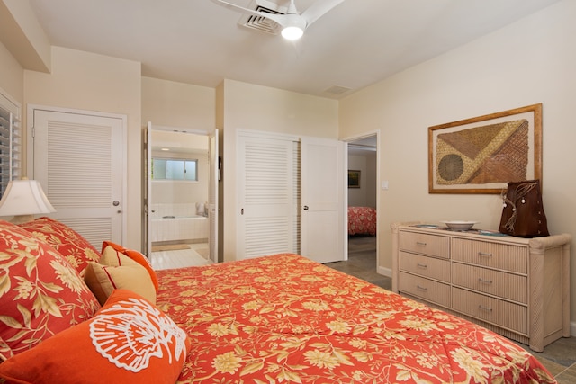 bedroom with multiple closets, ceiling fan, and ensuite bathroom