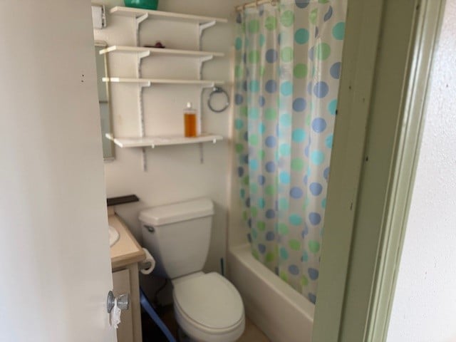 full bathroom with toilet, vanity, and shower / bath combination with curtain