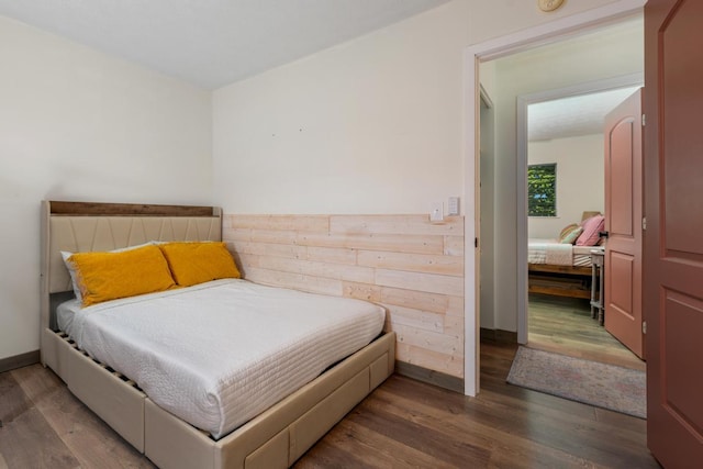 bedroom featuring dark hardwood / wood-style flooring