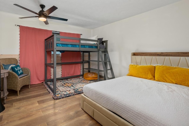 bedroom featuring ceiling fan and hardwood / wood-style flooring