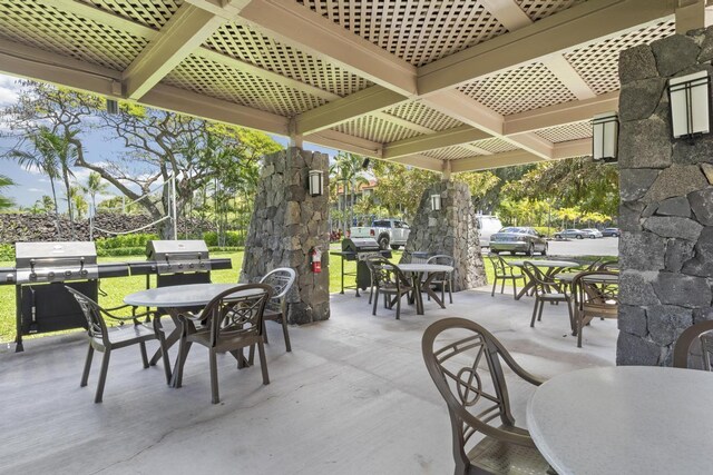 view of patio featuring a grill