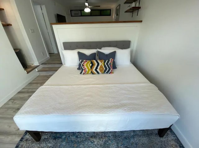 bedroom featuring wood-type flooring