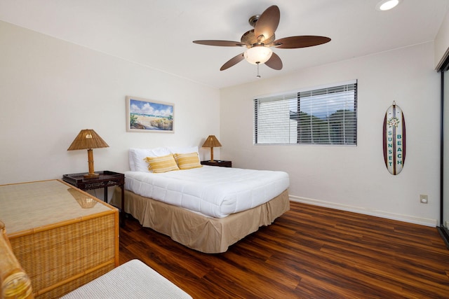 bedroom featuring dark hardwood / wood-style floors and ceiling fan