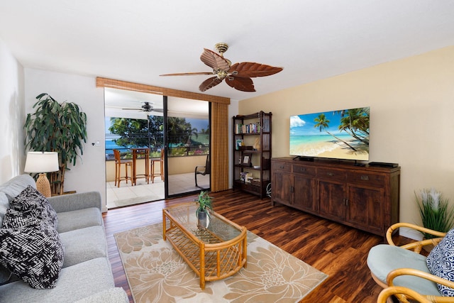 living room with ceiling fan and dark hardwood / wood-style floors