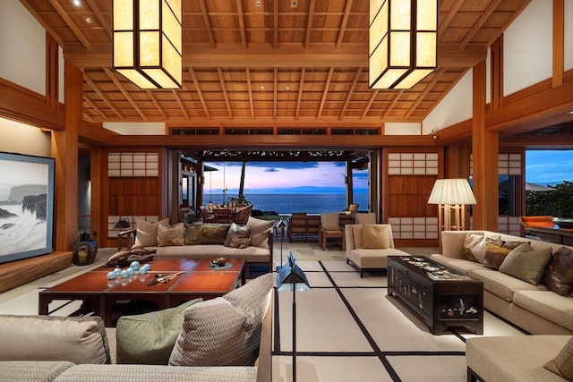 living room featuring high vaulted ceiling and wooden ceiling