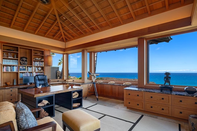 office featuring vaulted ceiling with beams, wood ceiling, a wealth of natural light, and a water view