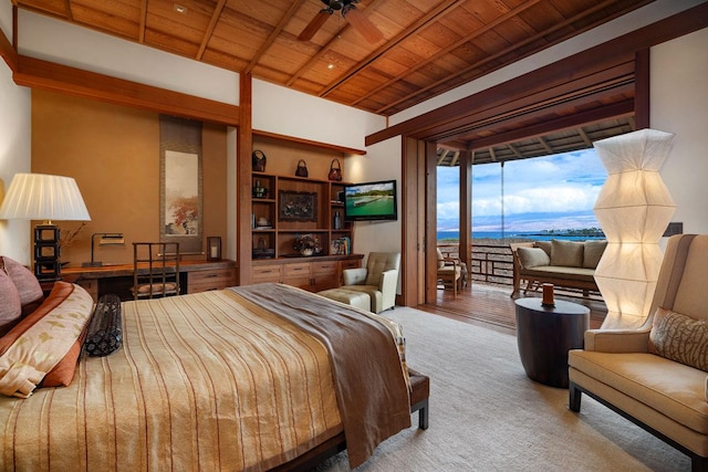 carpeted bedroom featuring access to outside and wooden ceiling