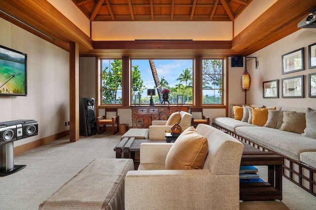 carpeted cinema with wood ceiling and beamed ceiling