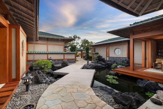 view of patio terrace at dusk