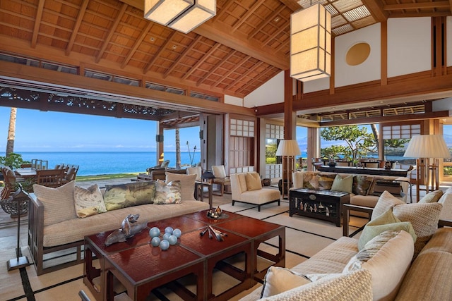 living room with beamed ceiling, a water view, wooden ceiling, and high vaulted ceiling