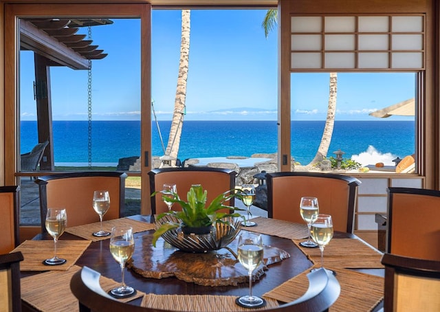 dining space with a water view