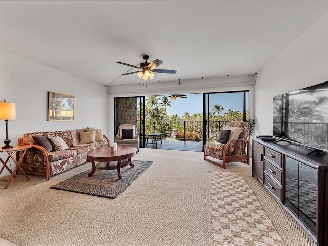 carpeted living room with ceiling fan