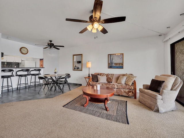 tiled living room featuring ceiling fan