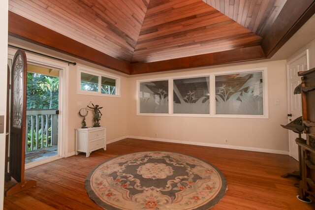 sitting room with lofted ceiling, hardwood / wood-style floors, and wooden ceiling