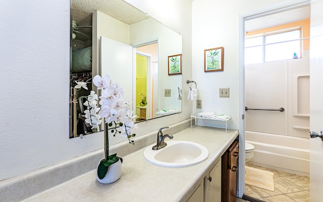 full bathroom featuring vanity, toilet, shower / bath combination, and tile patterned flooring