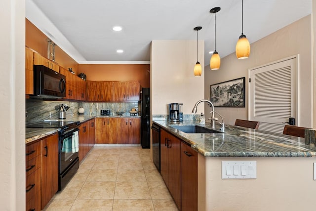 kitchen featuring pendant lighting, sink, dark stone countertops, backsplash, and black appliances