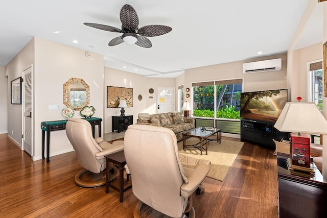 living room with dark hardwood / wood-style flooring, plenty of natural light, an AC wall unit, and ceiling fan