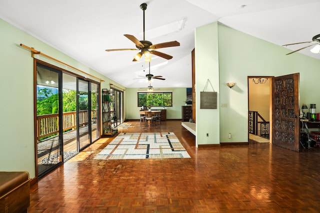 interior space with ceiling fan, dark parquet flooring, and high vaulted ceiling