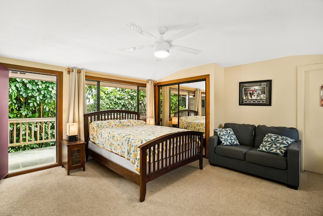 carpeted bedroom with ceiling fan, access to exterior, and vaulted ceiling