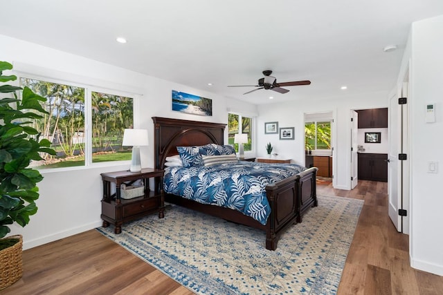 bedroom with hardwood / wood-style flooring and ceiling fan