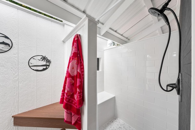 bathroom with tiled shower