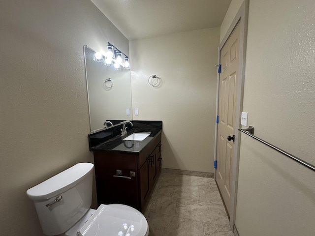 bathroom with toilet and vanity