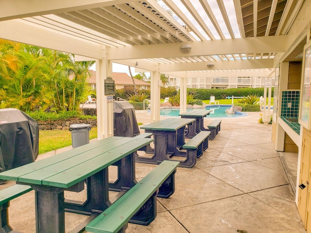 view of patio featuring pool water feature, a pergola, and area for grilling