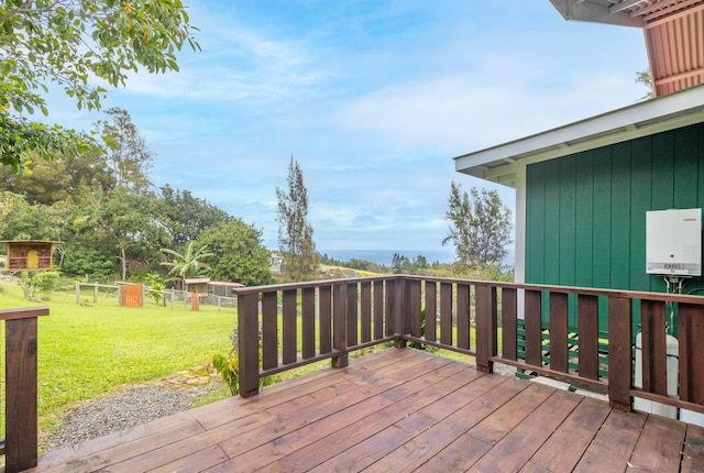 wooden terrace with a yard and water heater